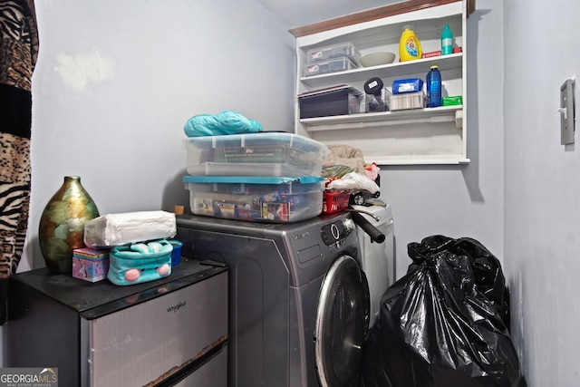 washroom with washing machine and dryer