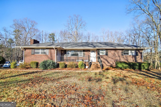 single story home with a front yard and a porch