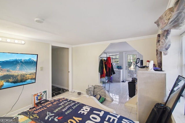 bedroom with light tile patterned flooring and crown molding