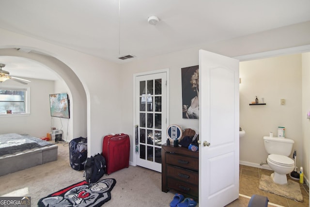 bedroom featuring ceiling fan and light carpet