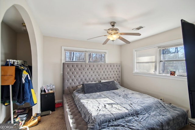 carpeted bedroom with ceiling fan