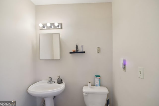 bathroom with toilet and sink