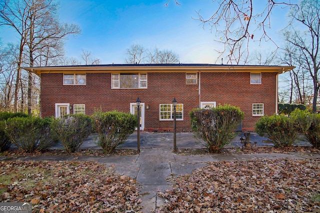 rear view of property featuring a patio area