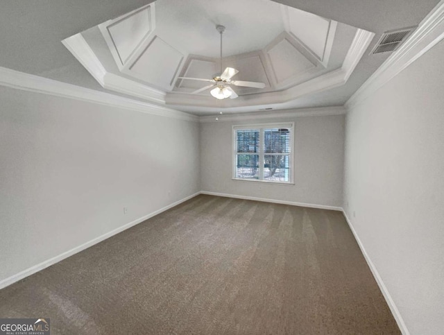 unfurnished room with ceiling fan, coffered ceiling, ornamental molding, and carpet flooring