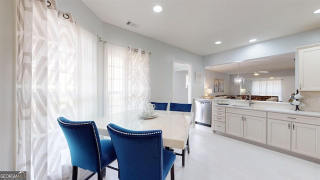 dining room featuring sink