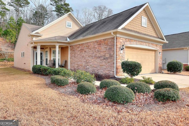 view of front facade with a garage and covered porch