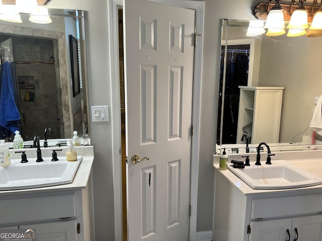 bathroom featuring vanity and tiled shower