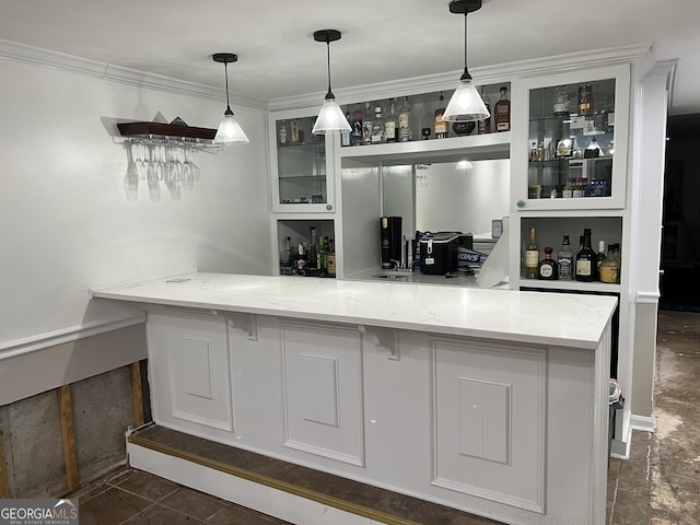 bar featuring light stone countertops, crown molding, and decorative light fixtures