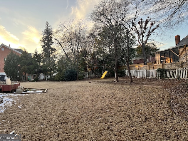 yard at dusk with a playground