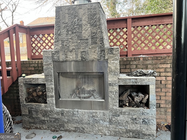 exterior space featuring a stone fireplace