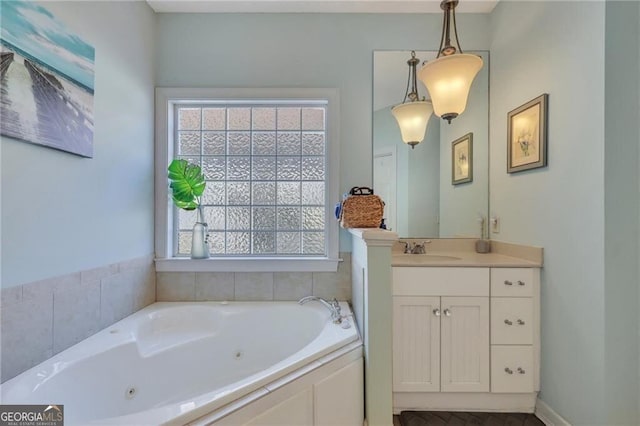 bathroom with a bath and vanity