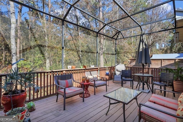 wooden terrace featuring glass enclosure