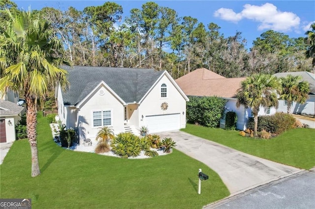 view of front of house with a front lawn and a garage