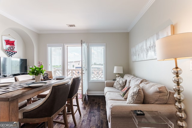 home office with dark hardwood / wood-style flooring and crown molding