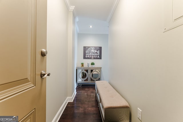 hall featuring ornamental molding and dark hardwood / wood-style floors