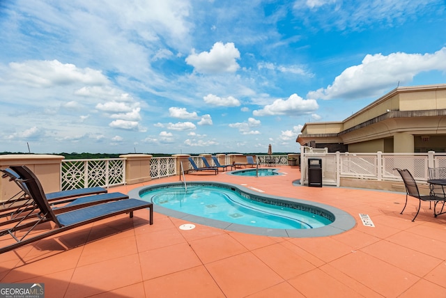 view of swimming pool featuring a patio