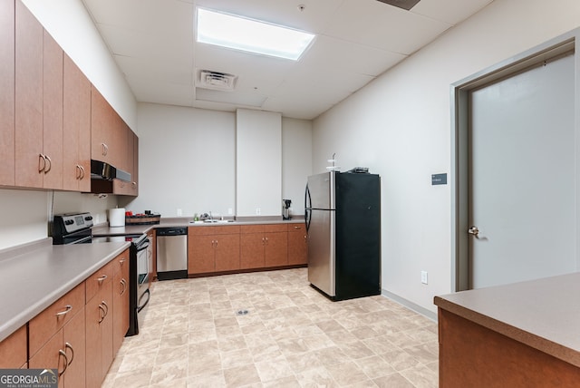 kitchen featuring appliances with stainless steel finishes and sink