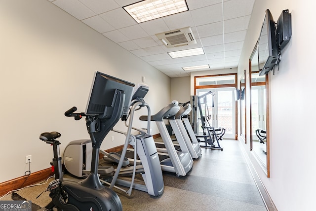 workout area with a drop ceiling