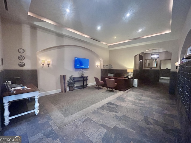 living room featuring a tray ceiling