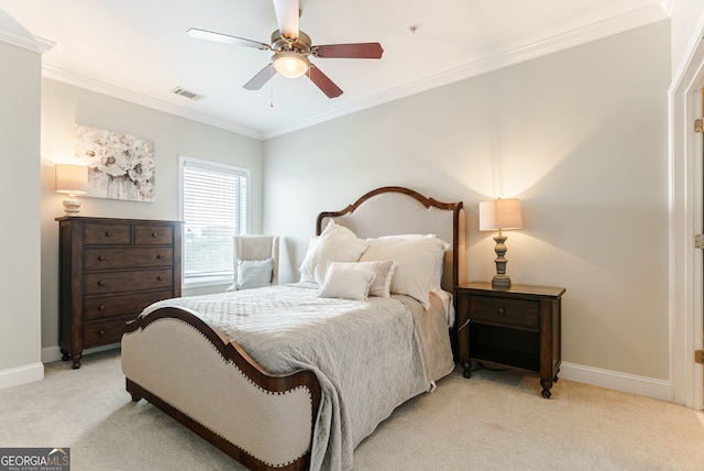 carpeted bedroom with ceiling fan and crown molding