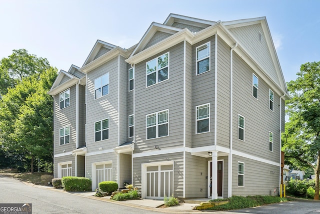 townhome / multi-family property featuring a garage