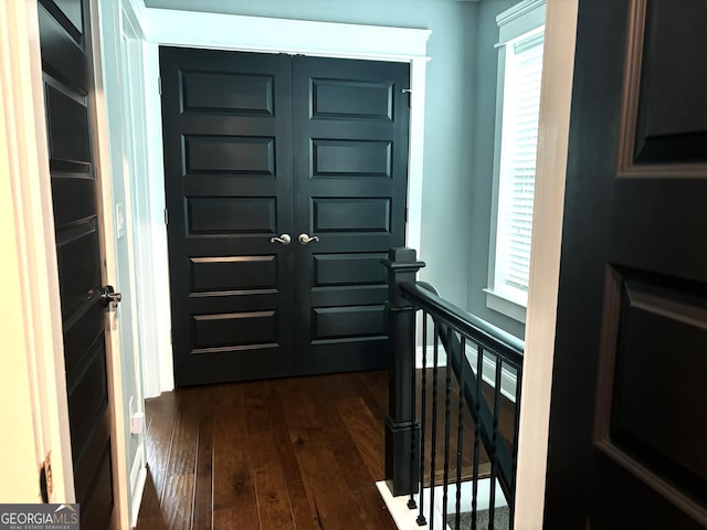 entryway with dark hardwood / wood-style floors