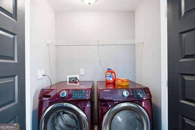 laundry room with washing machine and clothes dryer