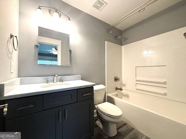 full bathroom with vanity, shower / tub combination, toilet, and wood-type flooring