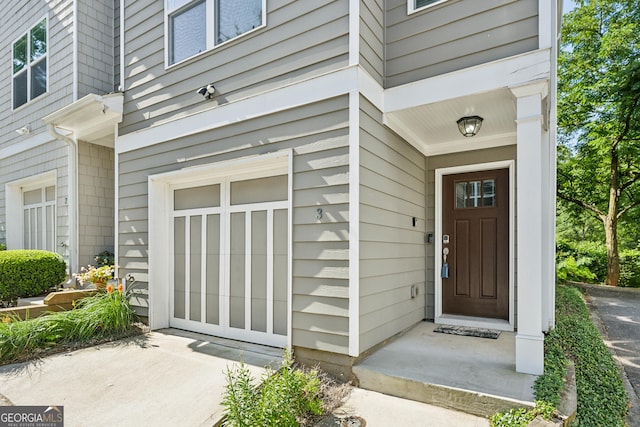 view of exterior entry featuring a garage