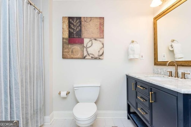 bathroom with toilet and vanity