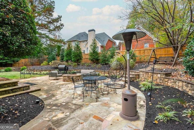 view of patio featuring an outdoor fire pit