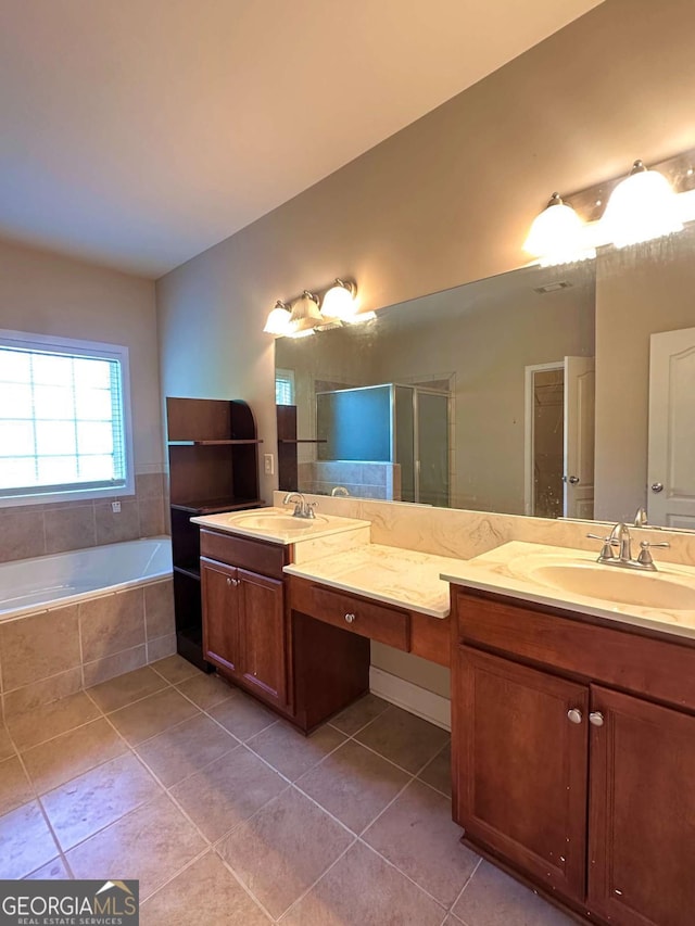 bathroom with separate shower and tub, vanity, and tile patterned flooring