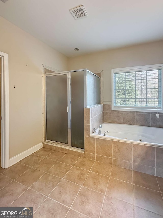 bathroom featuring tile patterned flooring and plus walk in shower