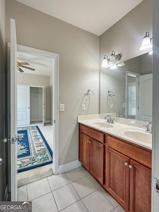 bathroom with ceiling fan, tile patterned floors, and vanity