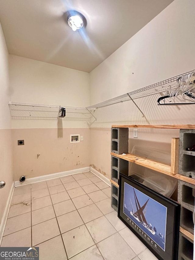 laundry room with washer hookup, electric dryer hookup, and tile patterned flooring