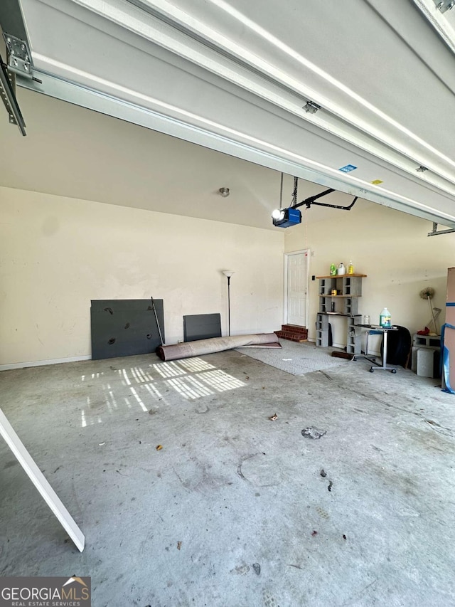 garage featuring a garage door opener