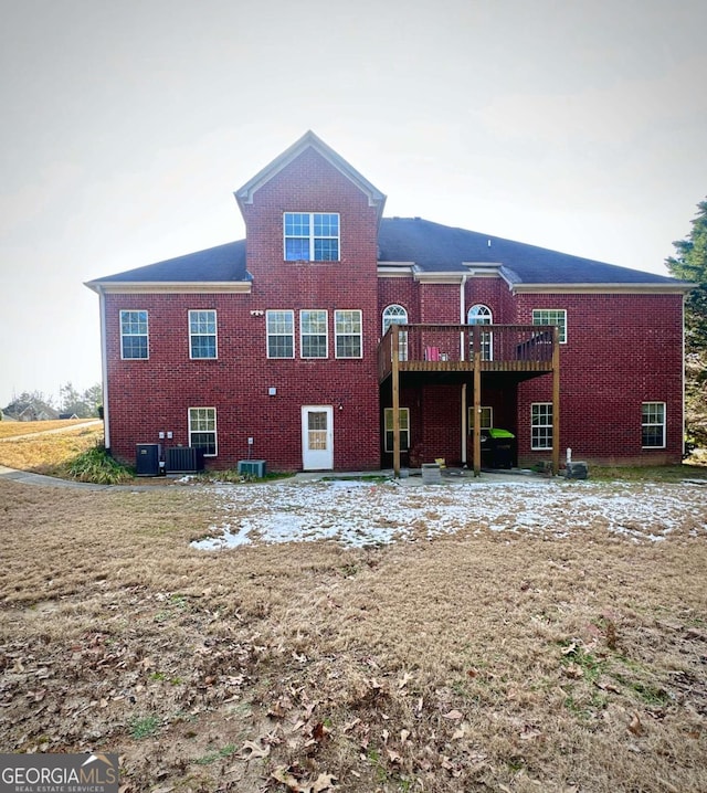 rear view of house featuring a deck and central AC unit