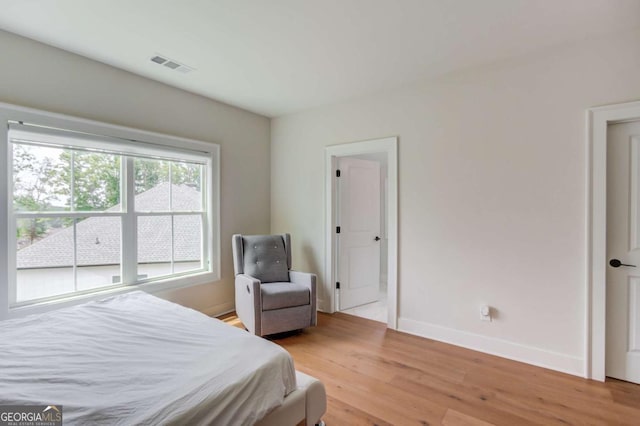 bedroom with light hardwood / wood-style floors