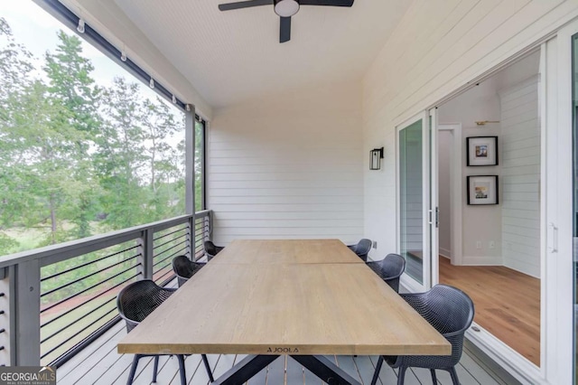 wooden deck with ceiling fan