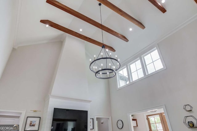 room details with beam ceiling and a chandelier