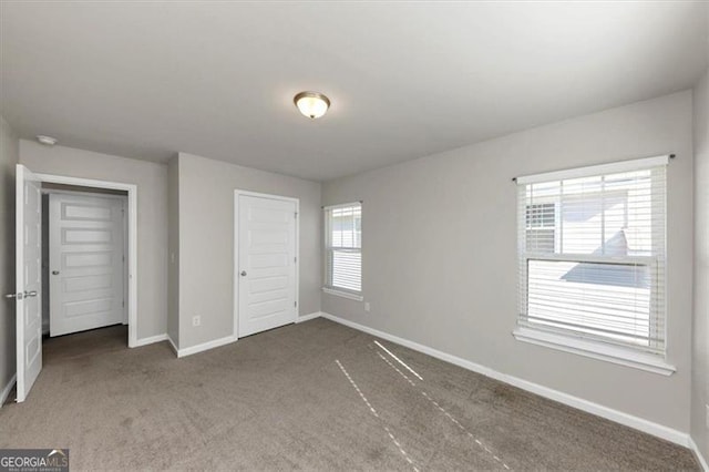 unfurnished bedroom with carpet floors