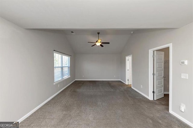 unfurnished living room featuring dark colored carpet, lofted ceiling, and ceiling fan