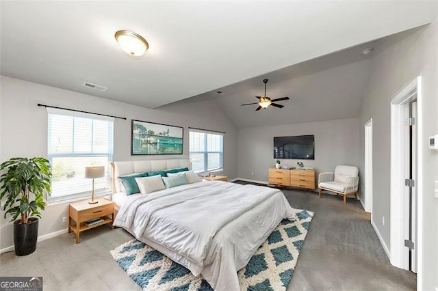 carpeted bedroom with ceiling fan and vaulted ceiling