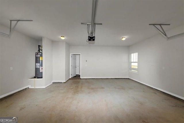 garage with a garage door opener and water heater