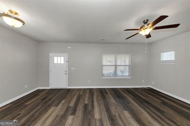 foyer with ceiling fan and dark hardwood / wood-style floors