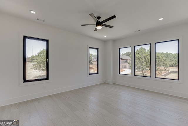 spare room with ceiling fan and light hardwood / wood-style flooring