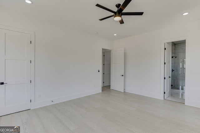 unfurnished bedroom featuring ceiling fan, connected bathroom, and light hardwood / wood-style floors