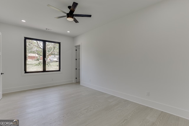 unfurnished room featuring ceiling fan and light hardwood / wood-style flooring