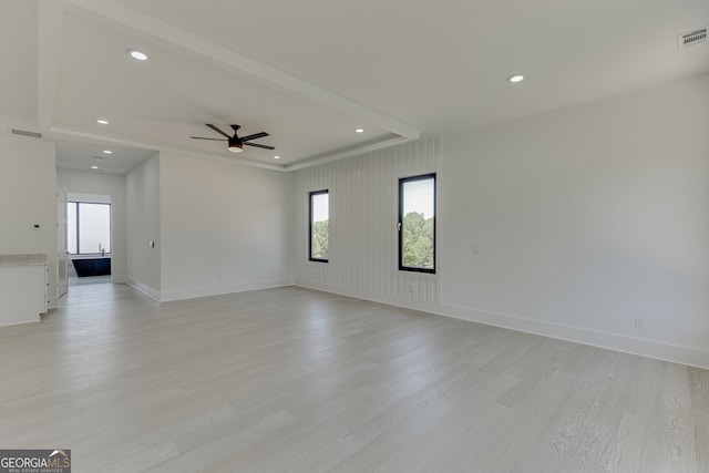 unfurnished room with ceiling fan and light hardwood / wood-style floors