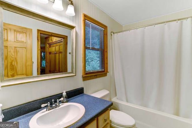 full bathroom with toilet, vanity, and shower / bath combo with shower curtain